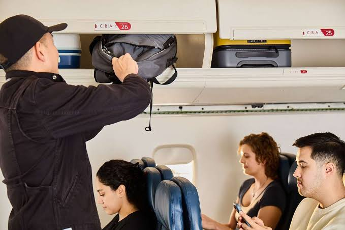 789 Storing Overhead Bags Behind Your Seat