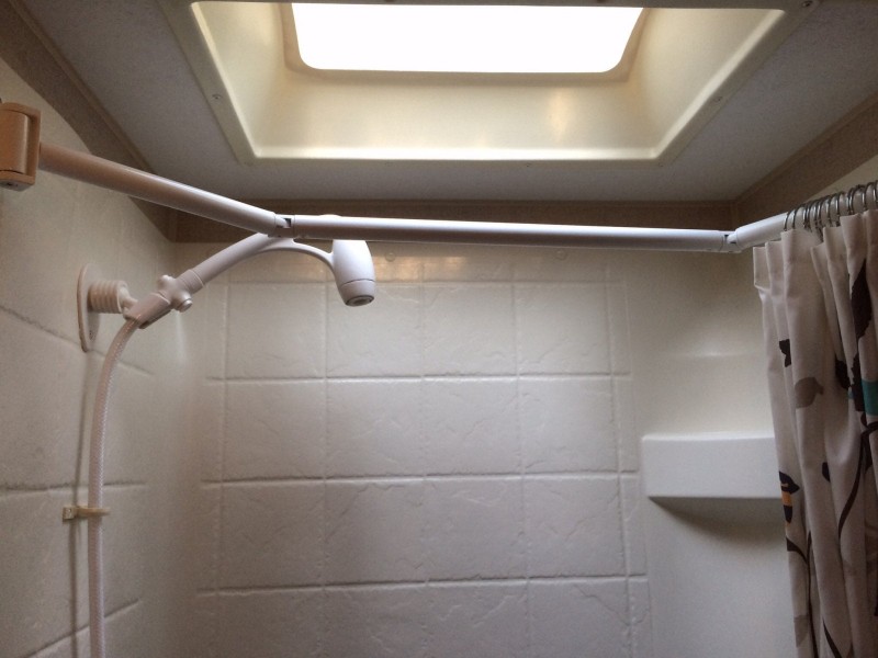 Add a Shower Head With a Pause Button to Save Water