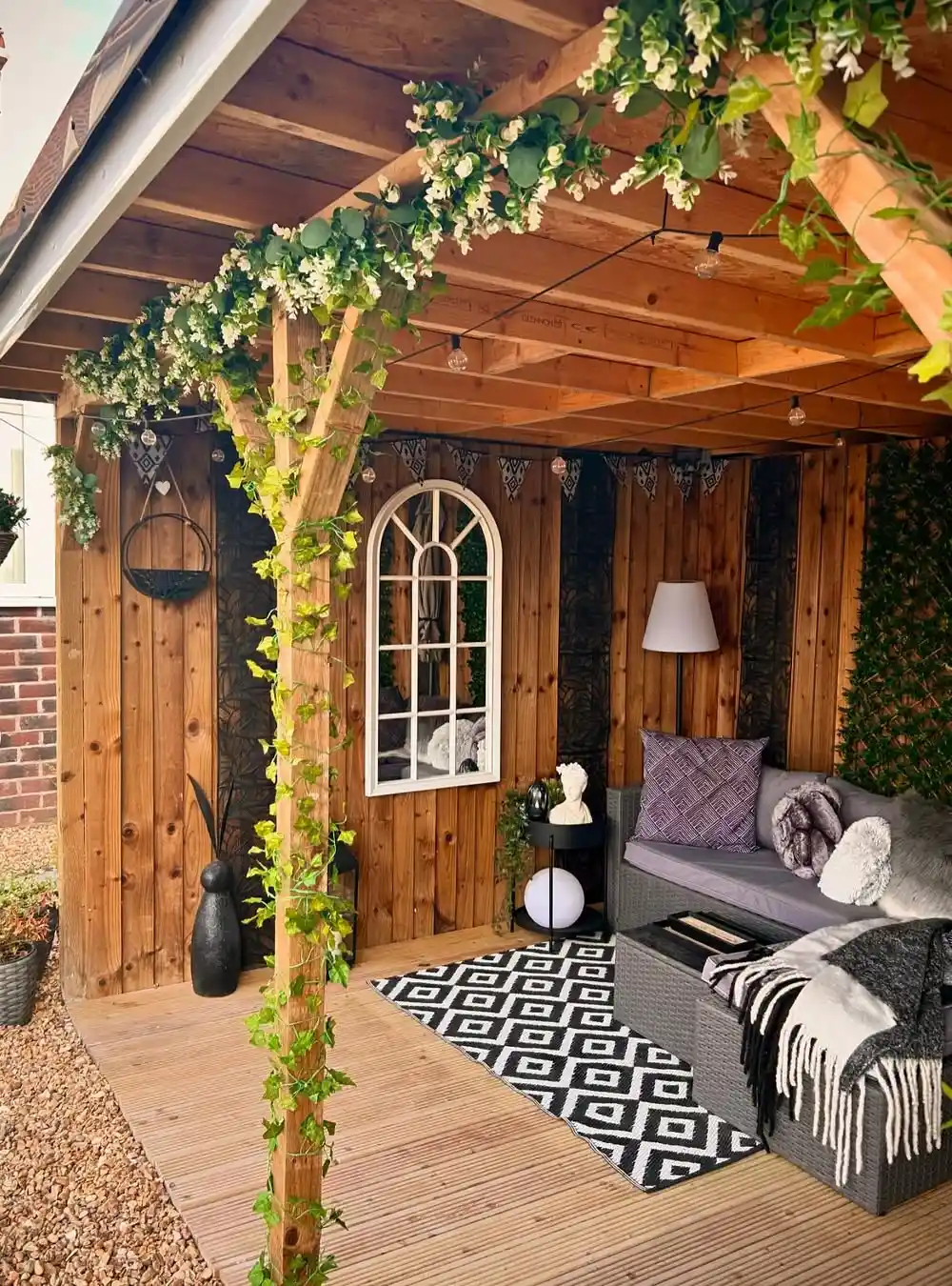 Cozy Wooden Pergola with Greenery and Decorative Lighting