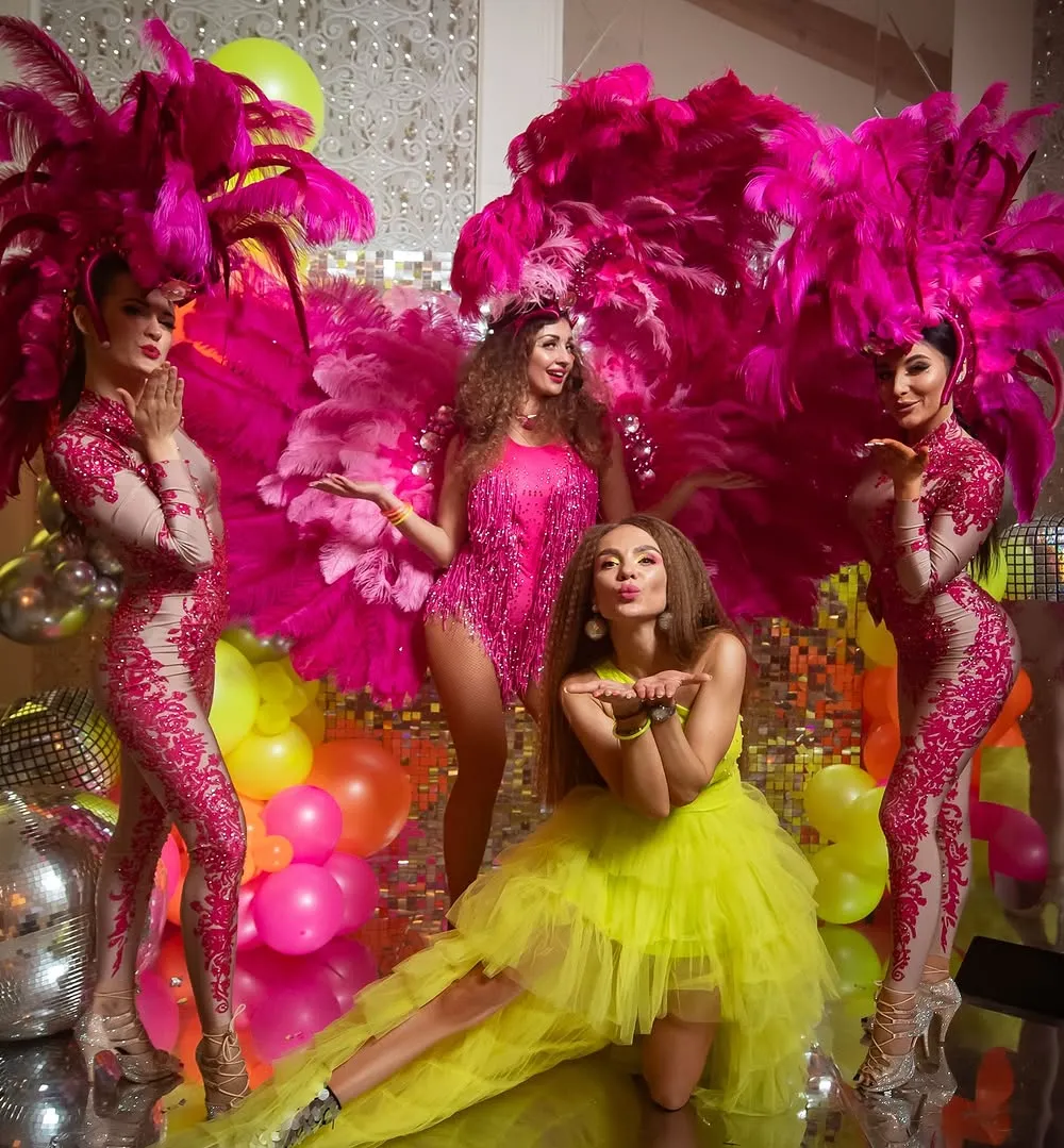 Neon Dance Party with Performers in Bright Costumes