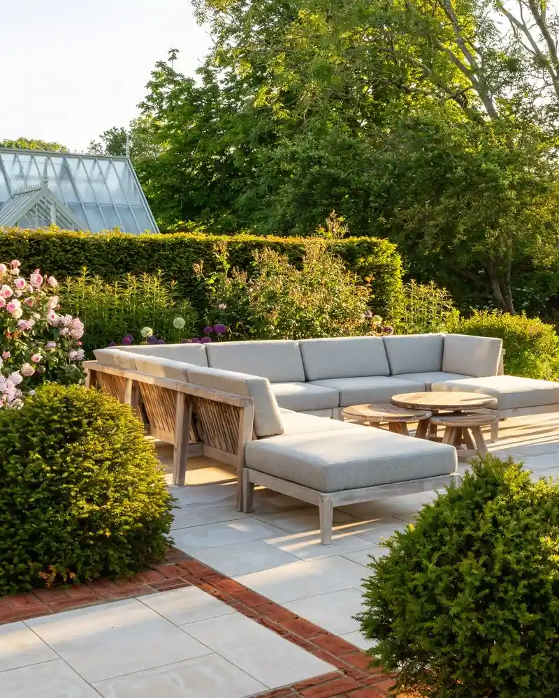 Teak Sectional Facing a Rose Border