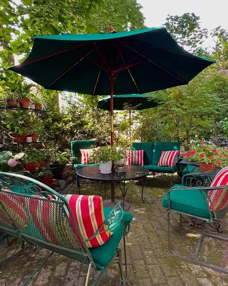 Vintage Wrought Iron Lounge with Green Umbrellas
