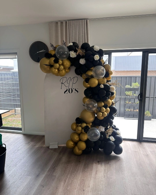 White Arch with Gold and Black Garland